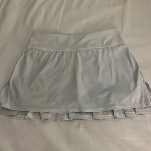 Lululemon white mini skirt with ruffles on back. Size 2.